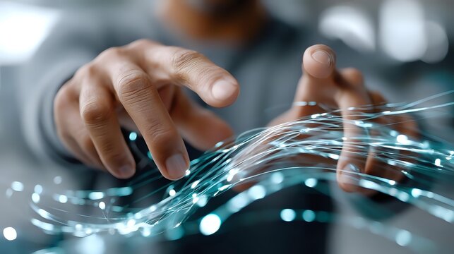 Male hands manipulating glowing fiber optic cables with blue light effects in technology environment, concept for digital connectivity and networking. - Powered by Adobe