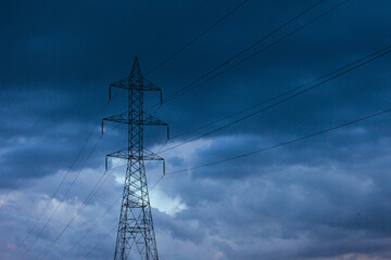 Storm clouds and high-voltage towers