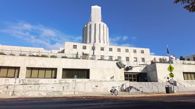 A grand exterior view of the Oregon State Capitol building in Salem, showcasing its unique Modernist and Art Deco architecture