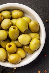 Green olives pickled seedless natural product tasty snack fresh delicious gourmet food background on the table rustic top view copy space