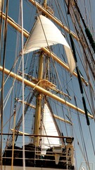 sails on the masts of a tall ship