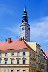 Historical clock tower soaring over vibrant city roofs, Brzeg, Poland
