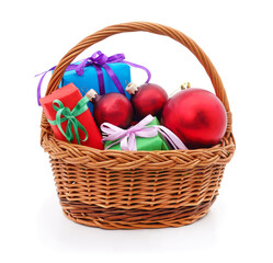 Basket with gift boxes and Christmas decorations.