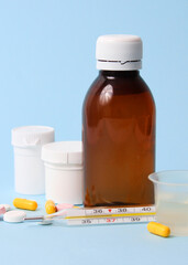  Set of medicines on a colored background close up. Vertical photo format