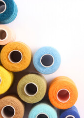 Threads for sewing and needlework close-up. Sewing accessories. Vertical photo format