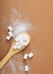 white sugar on the table on a light background close-up. Vertical photo format