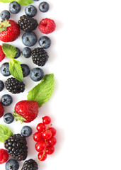 wild berries and mint leaves on a white background top view.. Vertical photo format