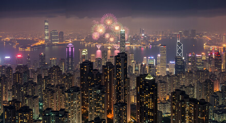 Obraz premium City skyline with fireworks celebrating New Year’s Eve at night 