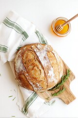 Sourdough bread loaf with honey and fresh rosemary