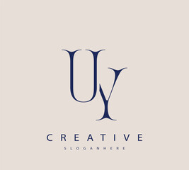 Sophisticated and stylish letter logo design featuring the combination of the letters U and Y in dark blue color scheme perfect for branding stationery website headers or social media graphics