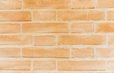Orange brick wall background texture with rectangular pattern and grunge look