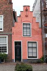 Pink Brick House Facade with Stepped Gable in Leiden, Netherlands