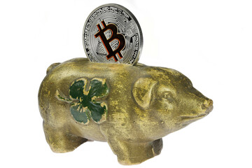 antique piggy bank with Bitcoin coin isolated on white background
