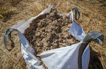Raffia large sack full of loam