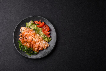 A food bowl with salmon, rice, avocado, tomatoes, and cucumbers. A salmon bowl