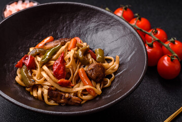 Asian food, noodles with vegetables, vegetarian dish with spicy sauce. Noodles with vegetables