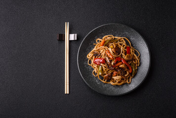 Asian food, noodles with vegetables, vegetarian dish with spicy sauce. Noodles with vegetables
