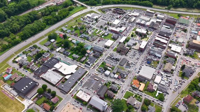 NORTH CAROLINA - 10.31.2025 - Very good aerial footage of a parade moving through a North Carolina city.