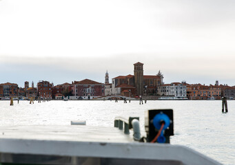 Murano, Italy - November 21, 2024: Scenic view of Murano Island from a boat, showcasing historic architecture and serene waters, perfect for travel enthusiasts and photographers seeking inspiration