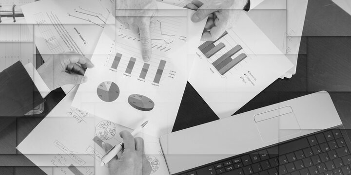Businesspeople having a discussion about financial report, geometric pattern