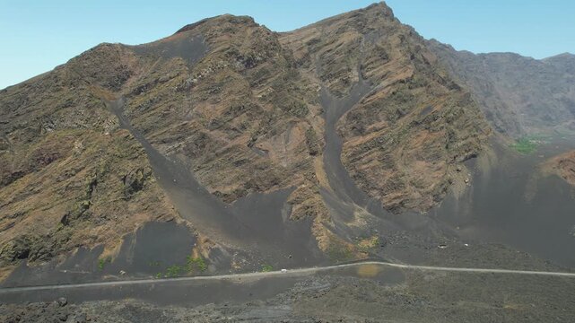 CAPE VERDE - 9.4.2025 - Incredible aerial view of a truck driving along a crater of the Pico do Fogo Volcano.