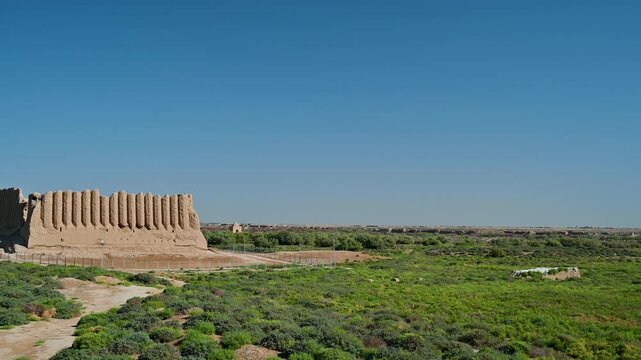 Panning view of the ruins of ancient Merv with Great Kyz Kala and the mausoleum of Sultan Sanjar near Mary, Turkmenistan