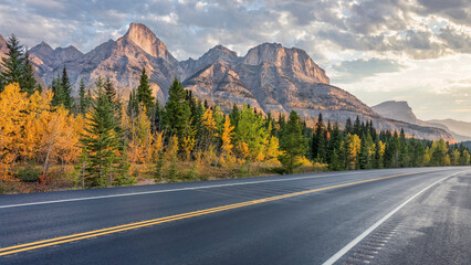 Naklejka premium Autumn Panorama of the David Thompson Highway 11 in Golden Hour morning light - near the Saskatchewan River Crossing entrance to the Icefields Parkway in Banff National Park