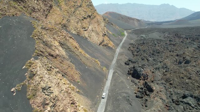 CAPE VERDE - 9.4.2025 - Great overhead view following a truck driving along a crater of the Pico do Fogo Volcano.