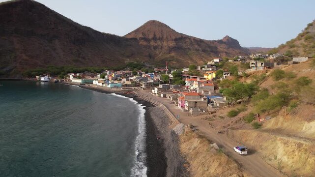 CAPE VERDE - 9.4.2025 - Excellent aerial footage following a car as it drives to a remote coastal village on Santiago, Cape Verde.