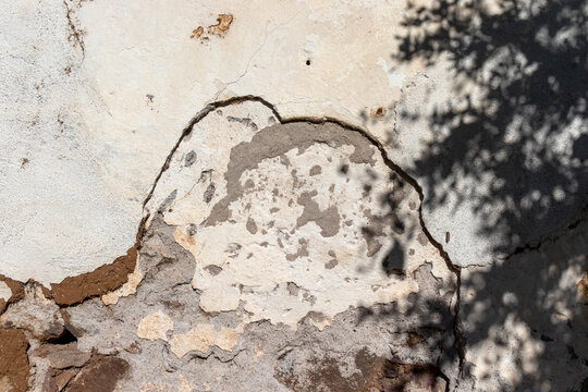 Adobe plaster masonry wall, peeling plaster