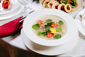 Traditional Ukrainian aspic kholodets with herbs and chili on festive holiday table