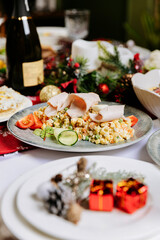 Traditional Olivier salad with turkey and vegetables on festive Christmas table