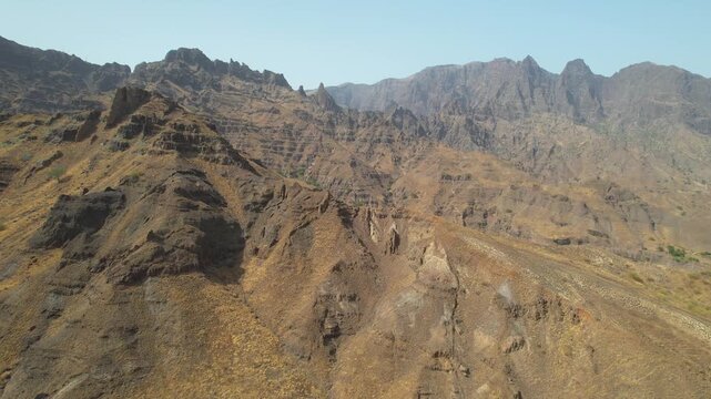 CAPE VERDE - 9.4.2025 - Beautiful aerial footage passing over an arid mountain range on Cape Verde's Santo Antao Island.