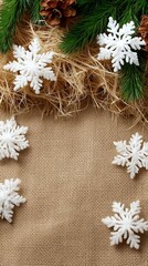 Festive winter scene with snowflakes and pine cones on burlap background