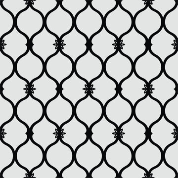 Seamless repeating geometric pattern of black ornate quatrefoil shapes on a light gray background