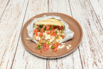 Venezuelan corn arepa with shredded beef and lots of cheese