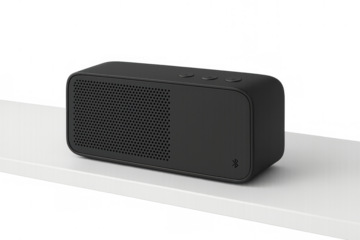 Black portable wireless bluetooth speaker on a white shelf, providing audio playback and wireless music technology, transparent background