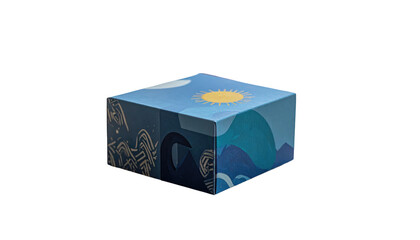 Cube-shaped box with a nature-themed design of sun, moon, mountains and ocean waves against a black background