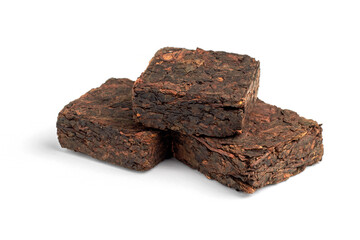 Three pieces of pressed fermented black tea isolated on white background.