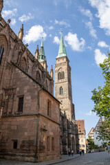 Fototapeta premium St. Sebald Church in Nuremberg, Germany, a Gothic Lutheran landmark with impressive stained-glass windows, artwork, and a grand historic organ in the old town.