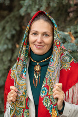 Close up portrait of a middle-aged woman in a headscarf