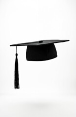Black graduation cap with tassel isolated on white. Symbol of academic achievement and degree completion. Represents university studies graduation success and learning.