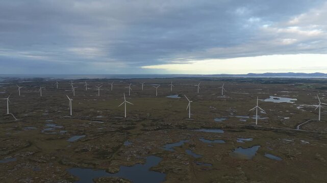Fields of wind towers producing clean electricity in Norway