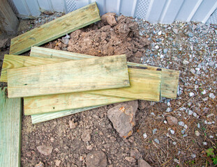 Leftover wood pieces in a pile on the ground
