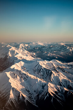 Aerial view of snowy mountains from an airplane