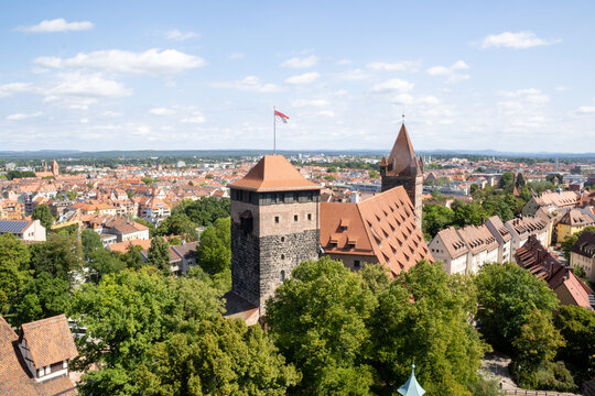 Panoramic view of Kaiserburg N&uuml;rnberg Castle from Sinwell Tower, Nuremberg, Germany, showcasing medieval architecture, royal palace, and historic gardens.