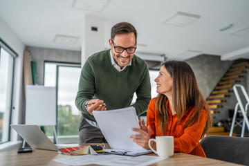 Couple planning home renovation budget and interior design