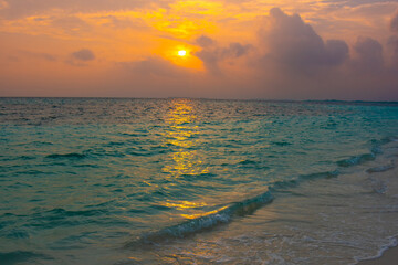 Beautiful sunset. Summer vacation, holiday amazing nature. Relax paradise, Maldives. Tropical island beach landscape exotic shore coast. Tranquil closeup calm sea water waves with palm trees. 