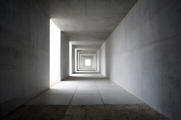 Fototapeta premium A minimalist concrete tunnel with light shining through an open door, symbolizing hope, direction, and the journey toward achievement.