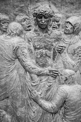 Station X: Jesus is stripped of his garments (Division of robes). The Way of the Cross on Mount Križevac (the Cross Mountain) in Medjugorje.